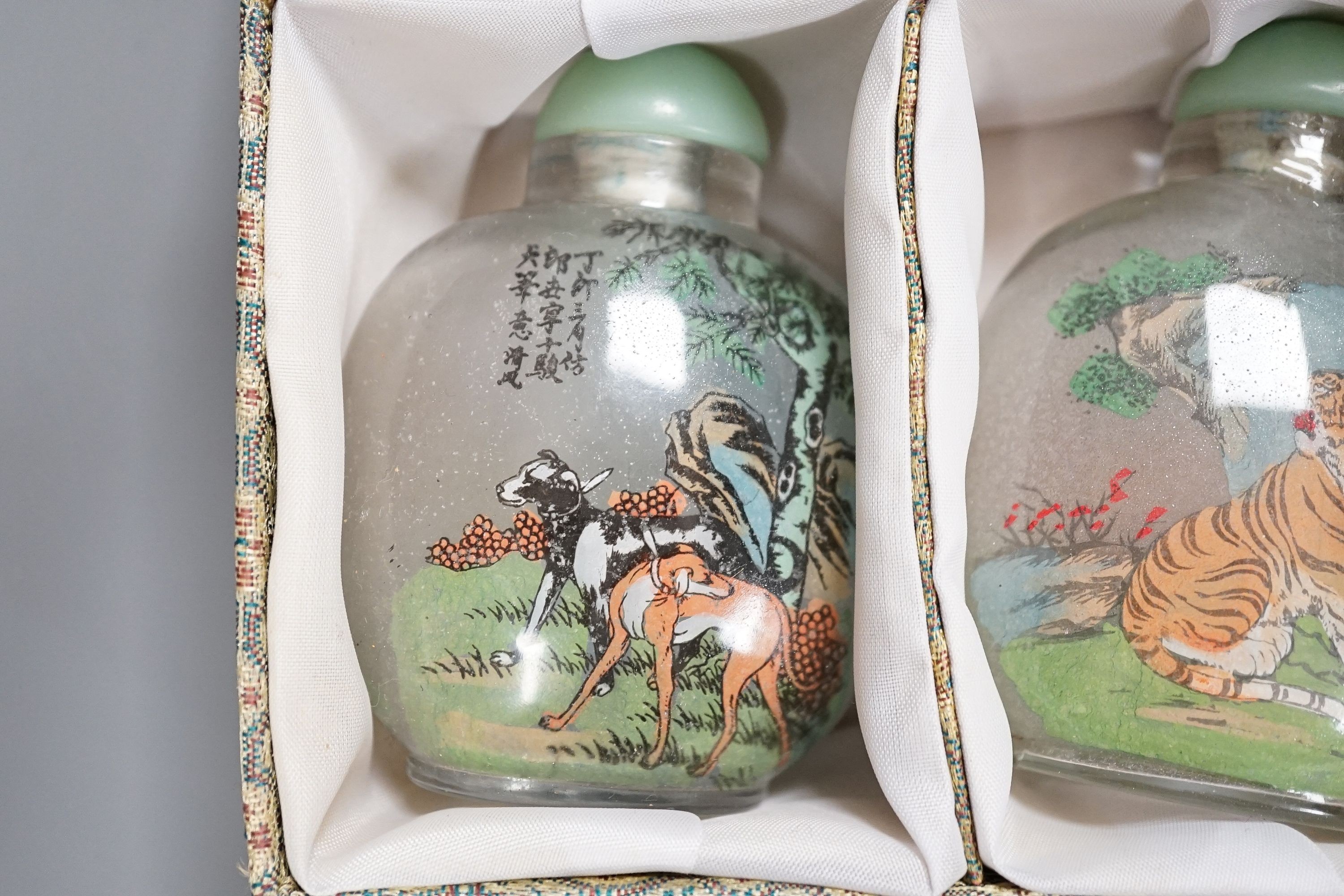 A boxed set of six Chinese inside-painted snuff bottles, height 8cm overall